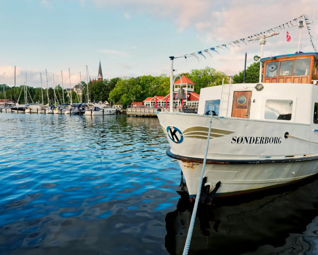 The Danish islands offer a rewarding mix of open-water sailing, compact harbours and coastal towns, making them a natural extension of a yacht charter from Heiligenhafen.
